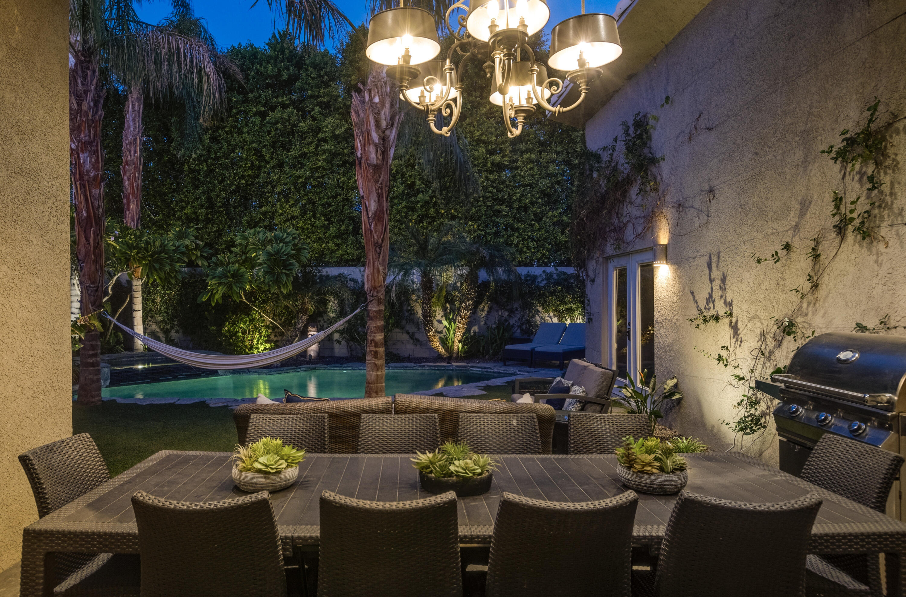 68590 Risueno Road Cathedral City, CA 92234 - Photo 63 of 72 a view of a patio with couches table and chairs and potted plants