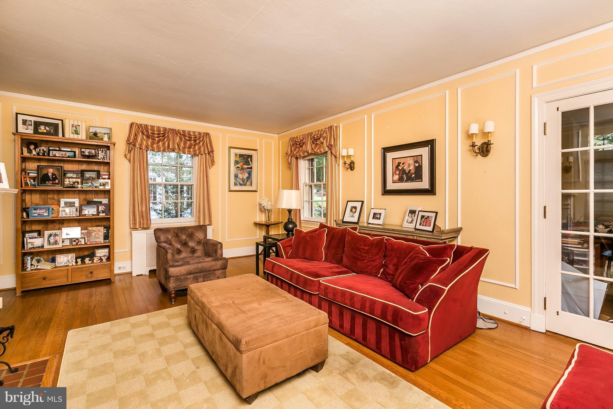 312 Broxton Road Baltimore, MD 21212 - Photo 5 of 29 Spacious Living Room leads to the bright Sunroom