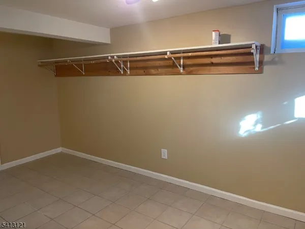 a bathroom with a sink and a window