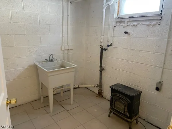 a view of a livingroom with wooden floor and a window