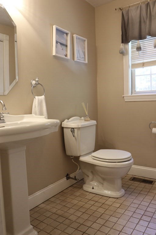 28 South Meadow Road Clinton, MA 01510 - Photo 11 of 24 a white toilet sitting next to a bathroom sink