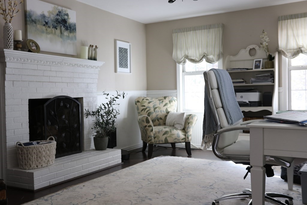 28 South Meadow Road Clinton, MA 01510 - Photo 14 of 24 a living room with furniture and a fireplace