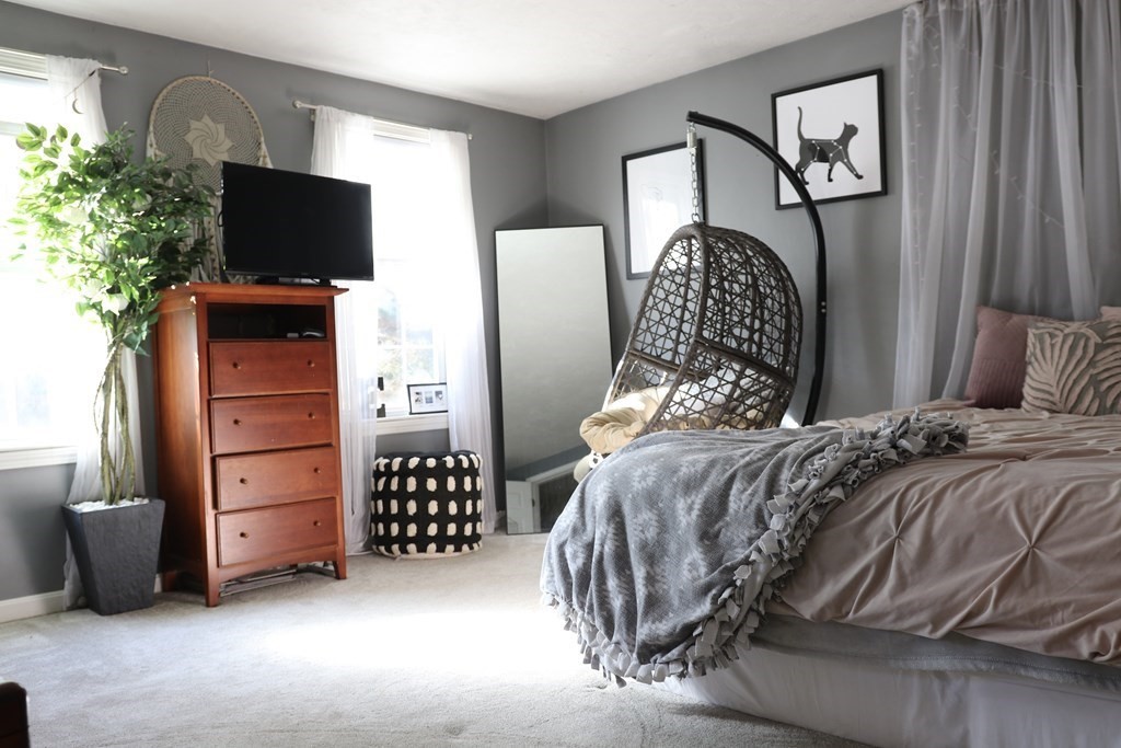 28 South Meadow Road Clinton, MA 01510 - Photo 19 of 24 a bedroom with a bed and a television