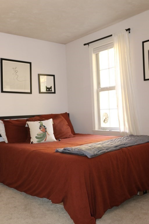 28 South Meadow Road Clinton, MA 01510 - Photo 22 of 24 a bedroom with a bed and a window