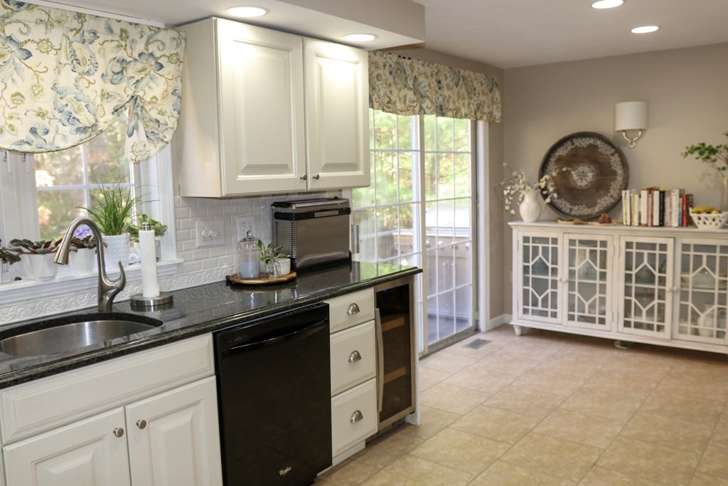 28 South Meadow Road Clinton, MA 01510 - Photo 9 of 24 a kitchen with stainless steel appliances granite countertop a sink a stove and cabinets