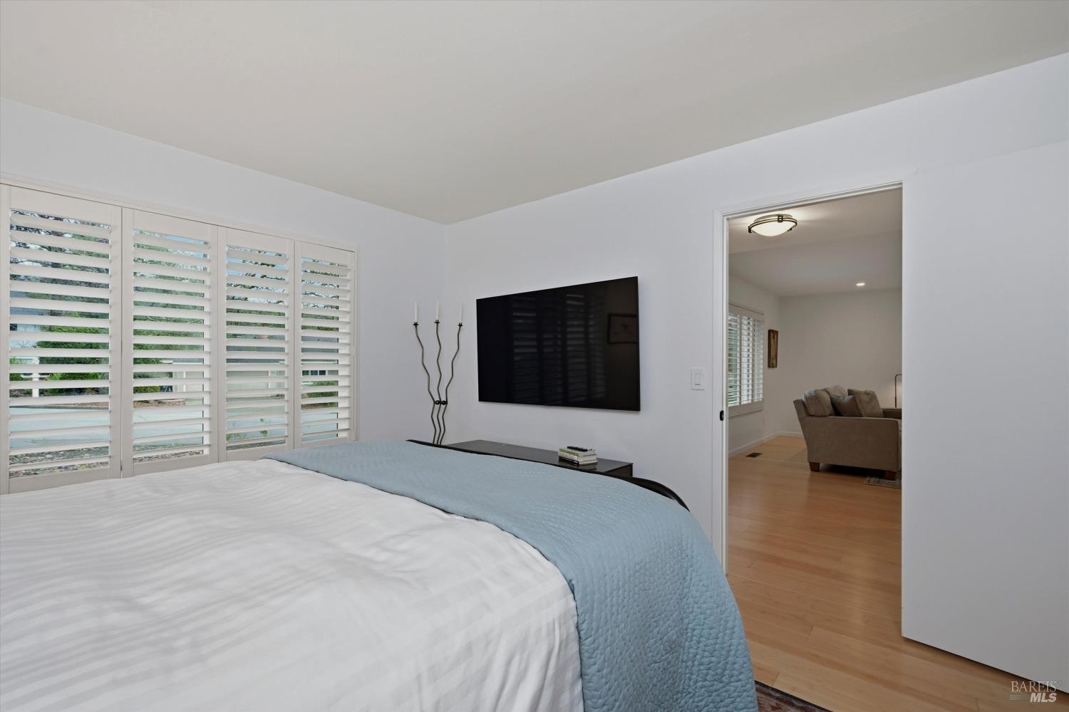 6480 Meadowridge Drive Santa Rosa, CA 95409 - Photo 20 of 26 a bedroom with a bed and a flat screen tv