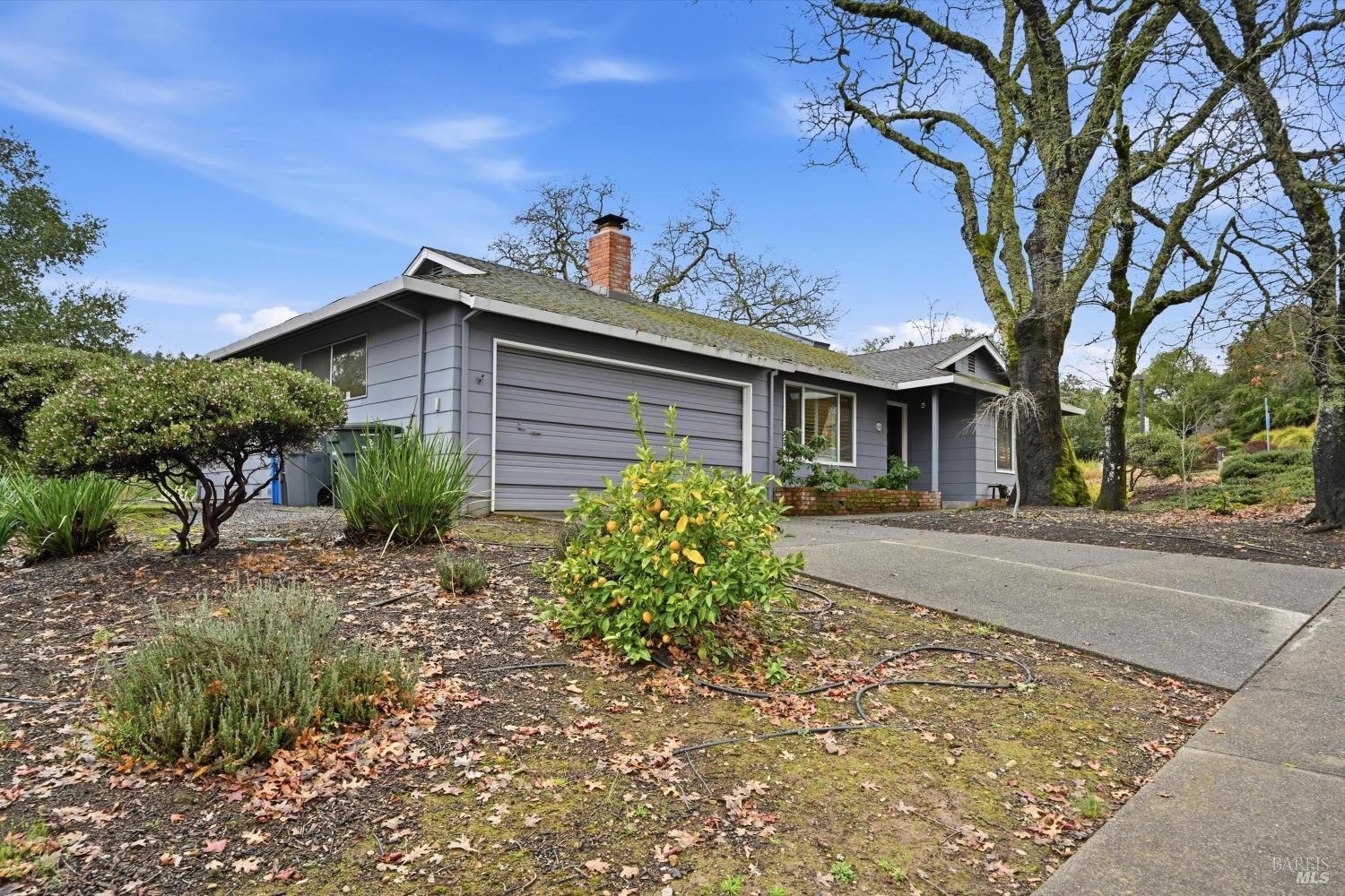 6480 Meadowridge Drive Santa Rosa, CA 95409 - Photo 2 of 26 a view of a house with a tree in the background