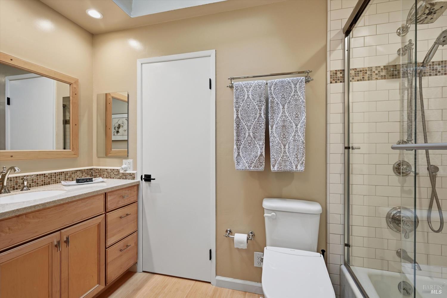 6480 Meadowridge Drive Santa Rosa, CA 95409 - Photo 21 of 26 a bathroom with a toilet sink vanity and shower