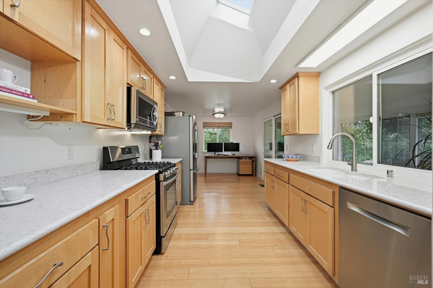 6480 Meadowridge Drive Santa Rosa, CA 95409 - Photo 9 of 26 a large kitchen with stainless steel appliances lots of counter space and a sink
