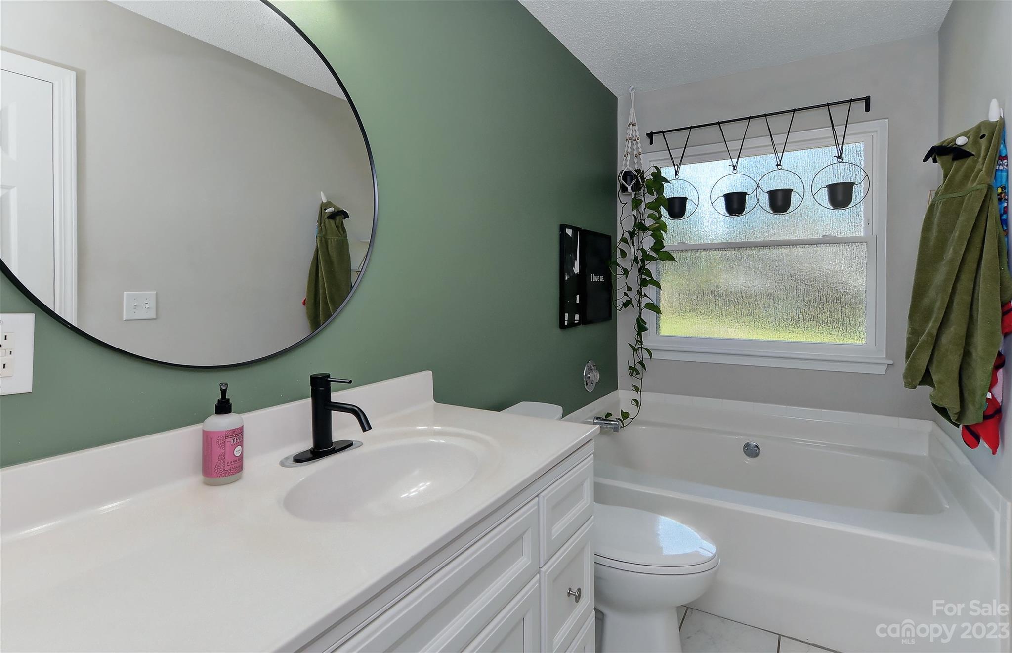 1016 Ridgefield Circle Indian Trail, NC 28079 - Photo 11 of 19 a bathroom with a sink a toilet and a bathtub