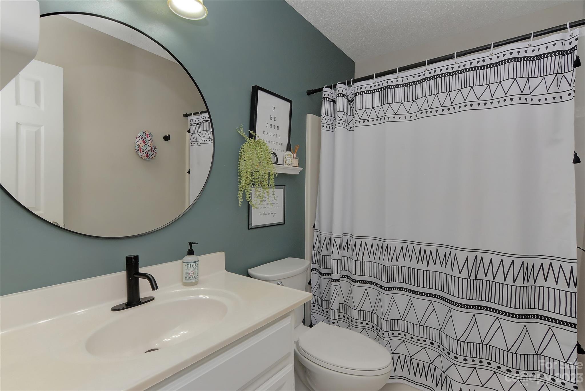 1016 Ridgefield Circle Indian Trail, NC 28079 - Photo 15 of 19 a bathroom with a sink a toilet and shower