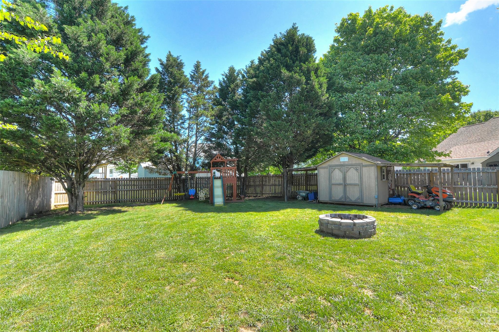 1016 Ridgefield Circle Indian Trail, NC 28079 - Photo 16 of 19 a view of a house with a yard and sitting area