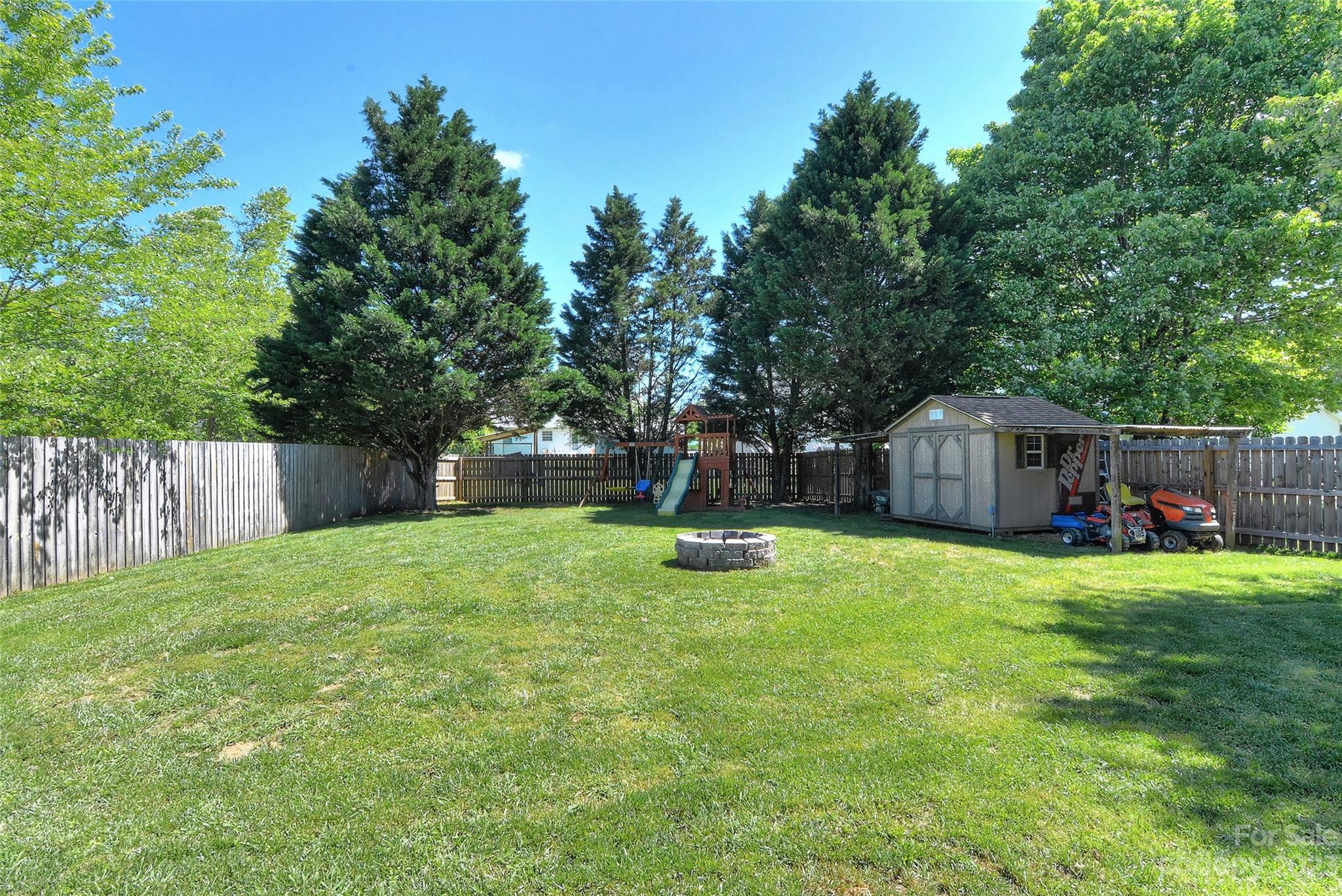 1016 Ridgefield Circle Indian Trail, NC 28079 - Photo 19 of 19 a view of a house with backyard and sitting area