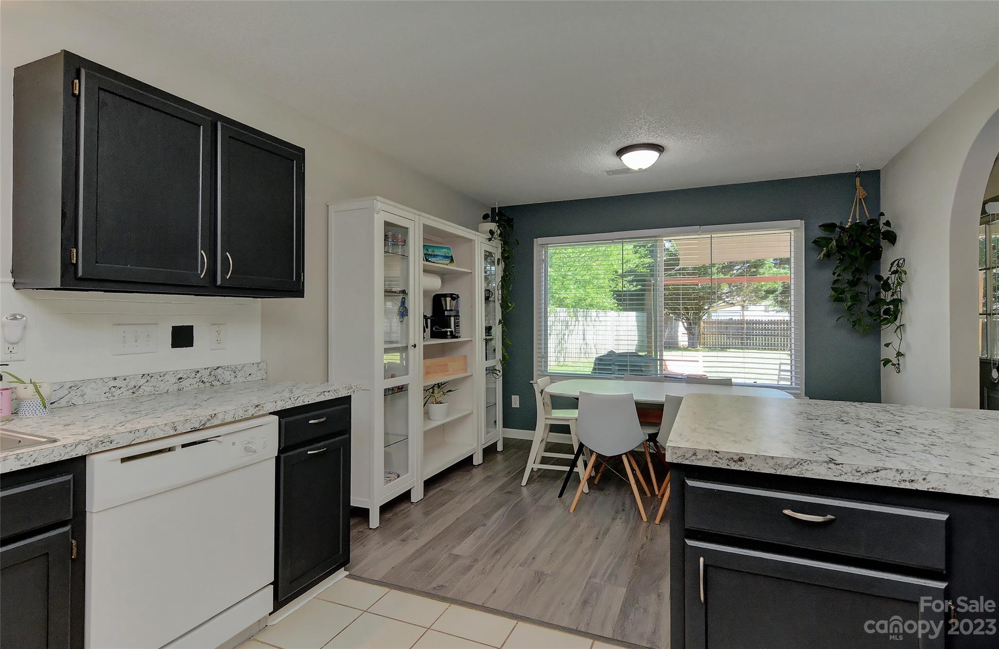 1016 Ridgefield Circle Indian Trail, NC 28079 - Photo 5 of 19 a kitchen with a stove sink and cabinets