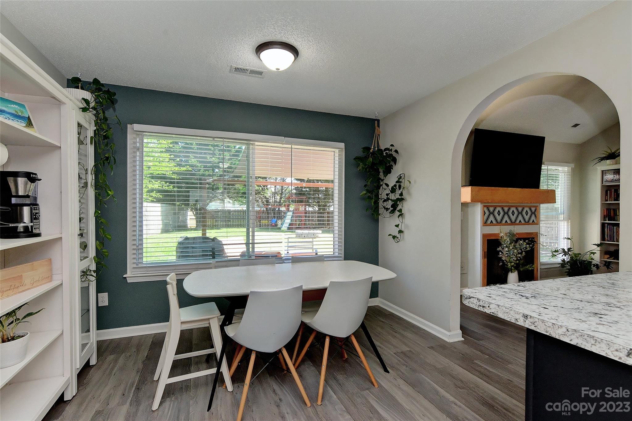 1016 Ridgefield Circle Indian Trail, NC 28079 - Photo 6 of 19 a view of a dining room with furniture and wooden floor