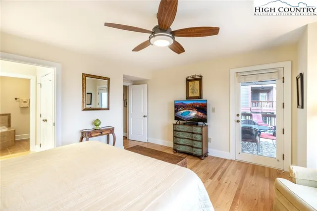 a spacious bathroom with a double vanity sink a mirror and a