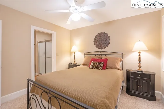 a bathroom with a sink vanity granite and toilet