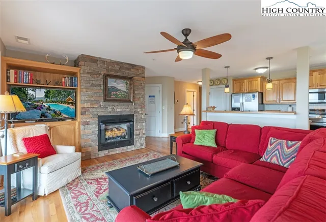 a living room with furniture and a fireplace