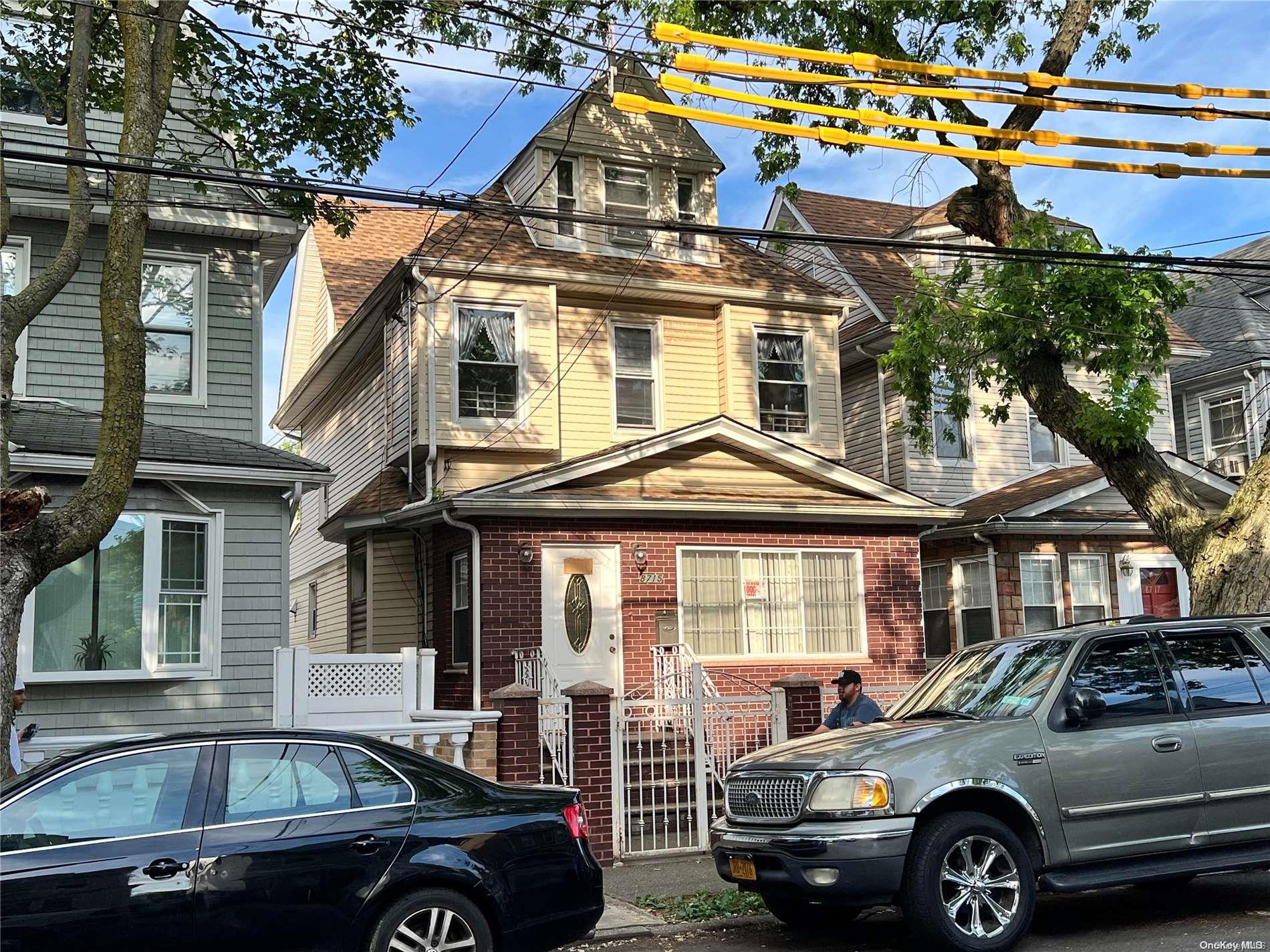 87-15 89th Street Queens, NY 11421 - Photo 1 of 1 a front view of a house with parking space