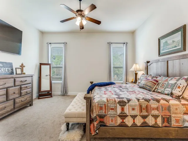 a bedroom with a bed furniture and a window