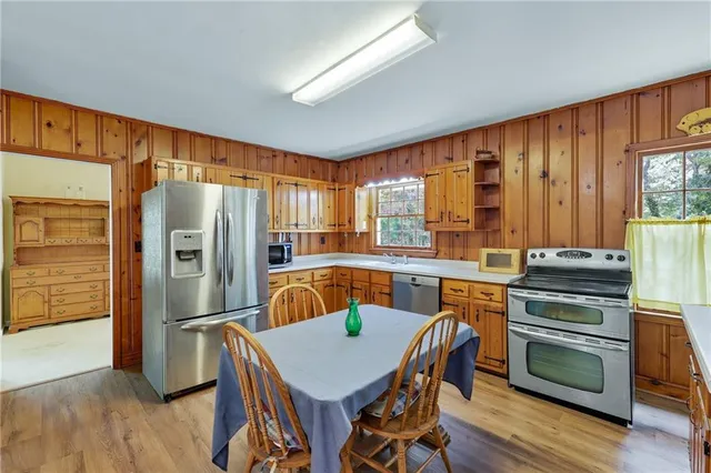 a view of a dining room with furniture window and wooden floor