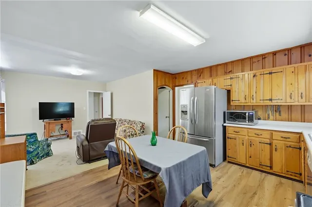 a bedroom with furniture and a flat screen tv