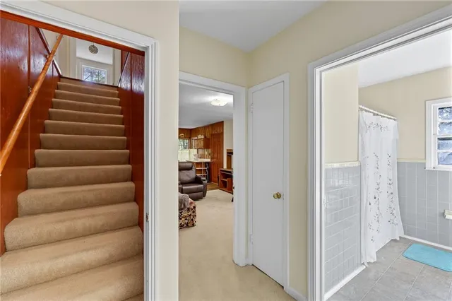 a view of a hallway with stairs