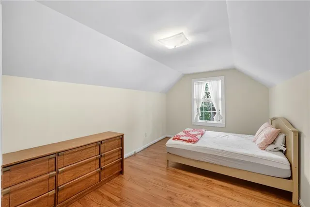 a bedroom with a bed and a table