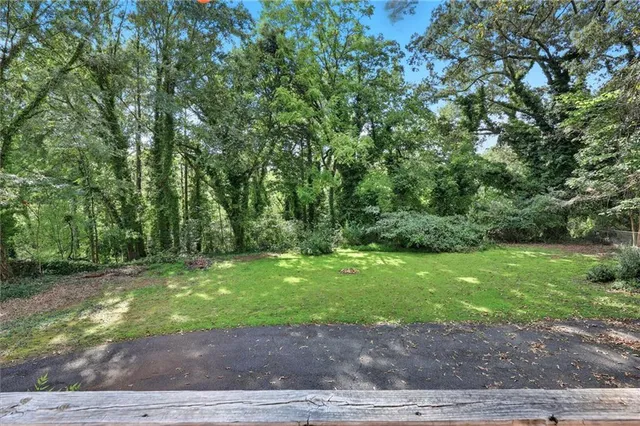 a backyard of a house with lots of green space