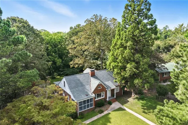 an aerial view of a house with yard