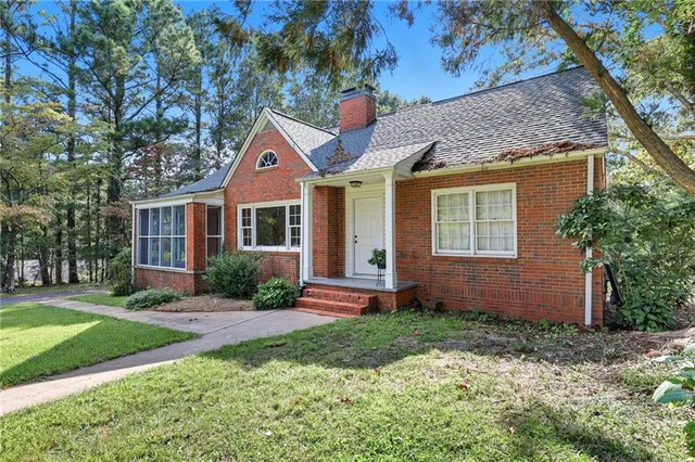 a potted plant sitting in front of a house