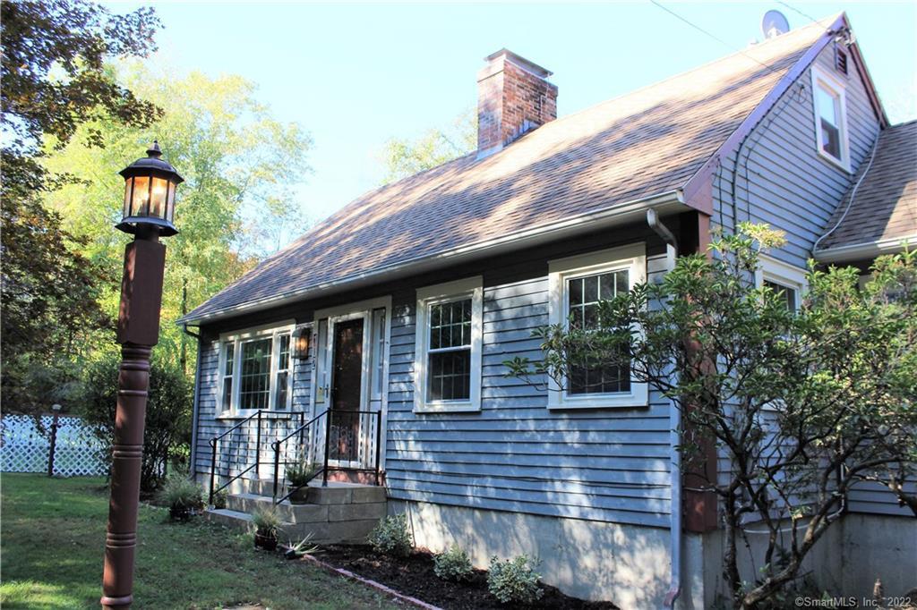 102 Plain Hill Road Sprague, CT 06330 - Photo 1 of 1 a front view of a house with garden