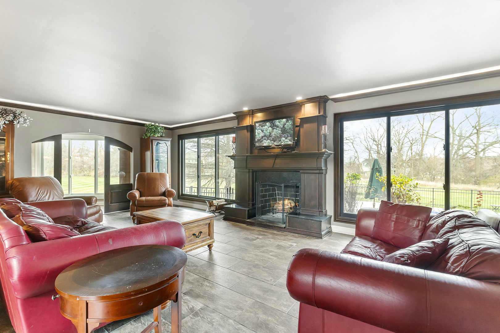5N259 Wilton Croft Road St. Charles, IL 60175 - Photo 14 of 48 a living room with furniture a large window and a fireplace
