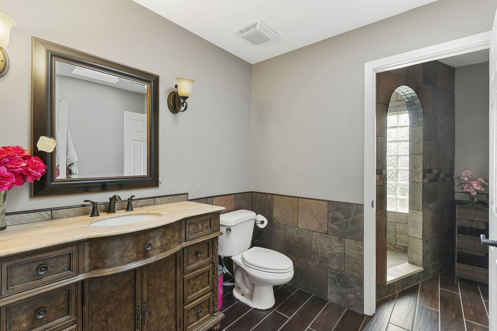 5N259 Wilton Croft Road St. Charles, IL 60175 - Photo 24 of 48 a bathroom with a toilet sink vanity and mirror