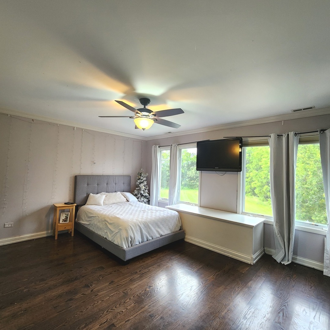 5N259 Wilton Croft Road St. Charles, IL 60175 - Photo 25 of 48 a bedroom with a large bed and a large window