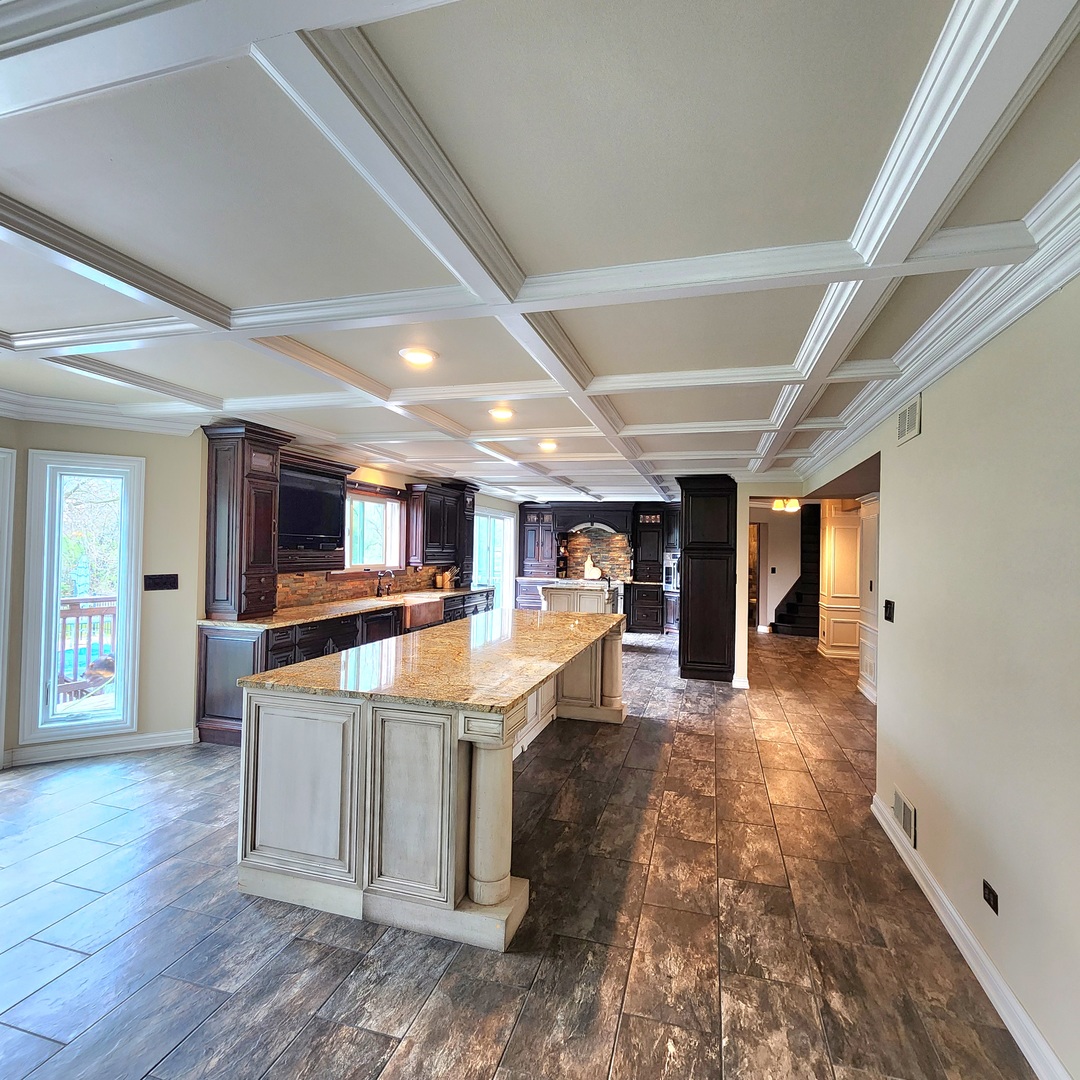 5N259 Wilton Croft Road St. Charles, IL 60175 - Photo 10 of 48 a dining hall with stainless steel appliances granite countertop a sink a stove and a wooden floors