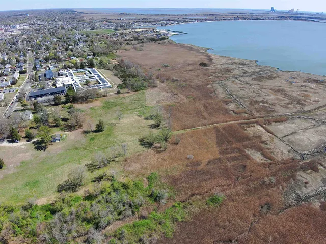 an aerial view of beach and ocean