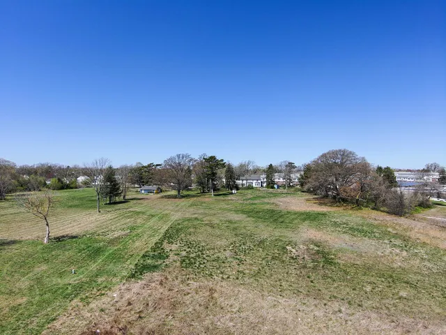 a view of a field with an trees
