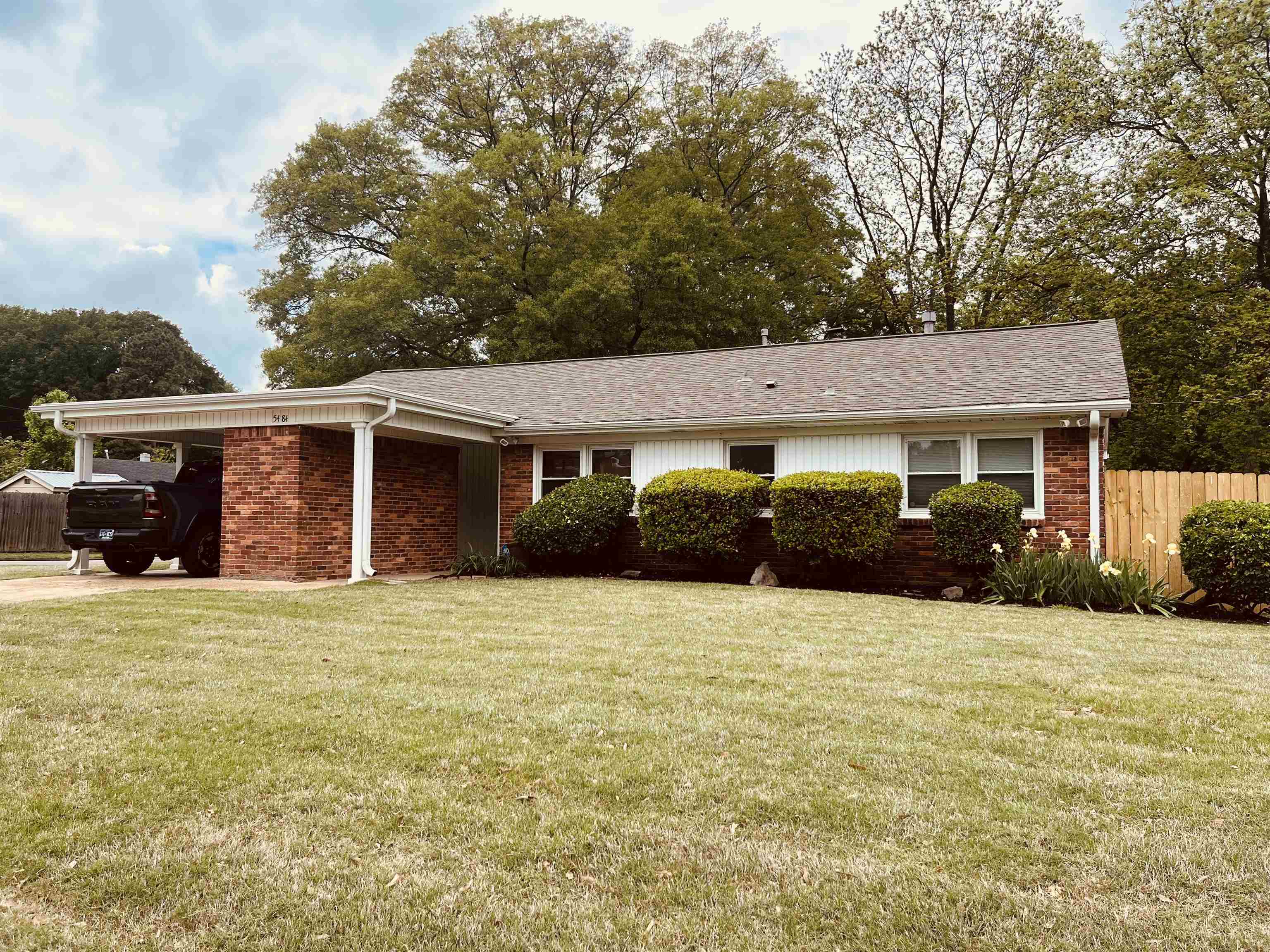 front view of a house with a yard