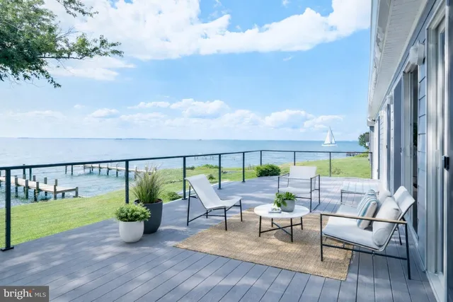 a balcony with furniture and garden view