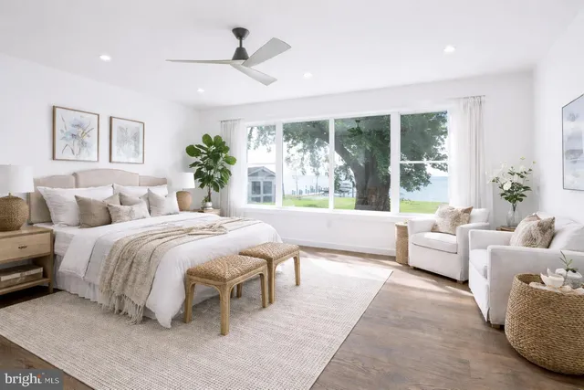 a spacious bedroom with a large bed and a couch