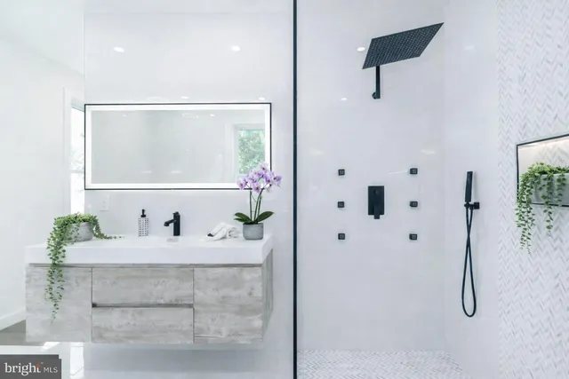 a bathroom with a sink and a mirror