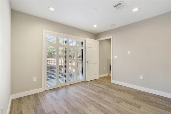 a kitchen with appliances a sink and cabinets