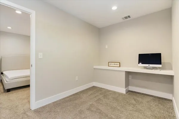 a utility room with sink dryer and washer