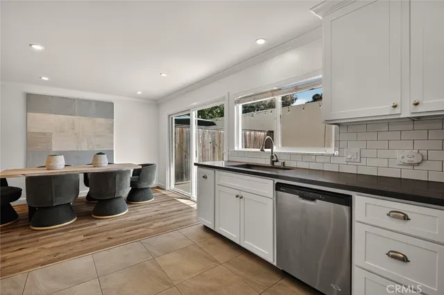 a kitchen with a sink and cabinets