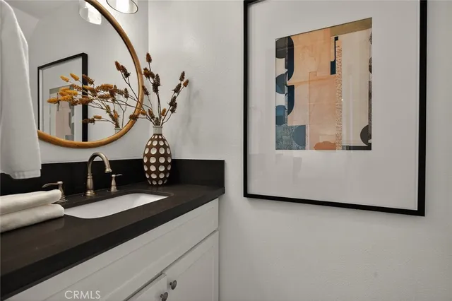 a view of living room with furniture and wooden floor