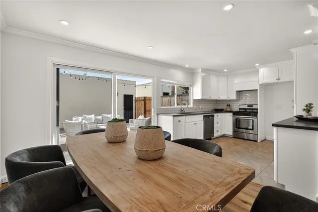 a kitchen with a table and chairs in it
