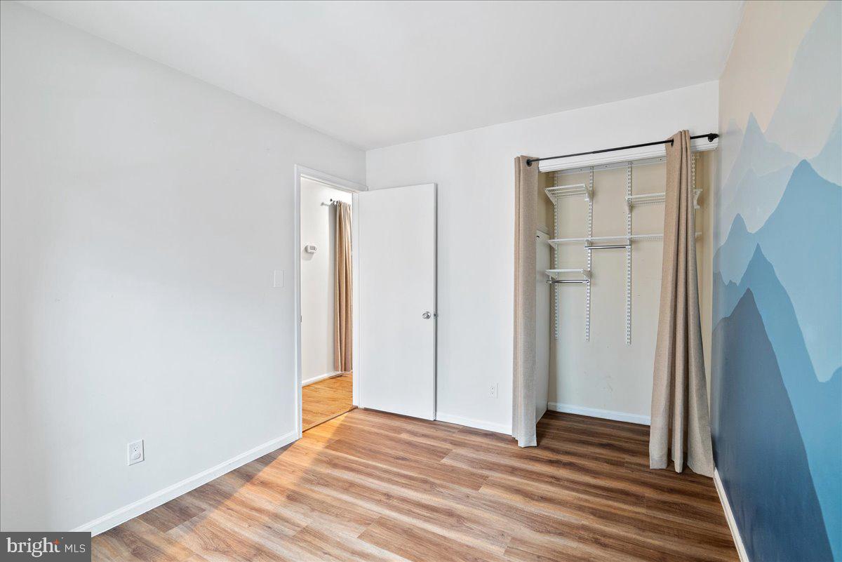 11146 Beaver Trail Court Reston, VA 20191 - Photo 11 of 17 a view of a room with wooden floor and a bathroom