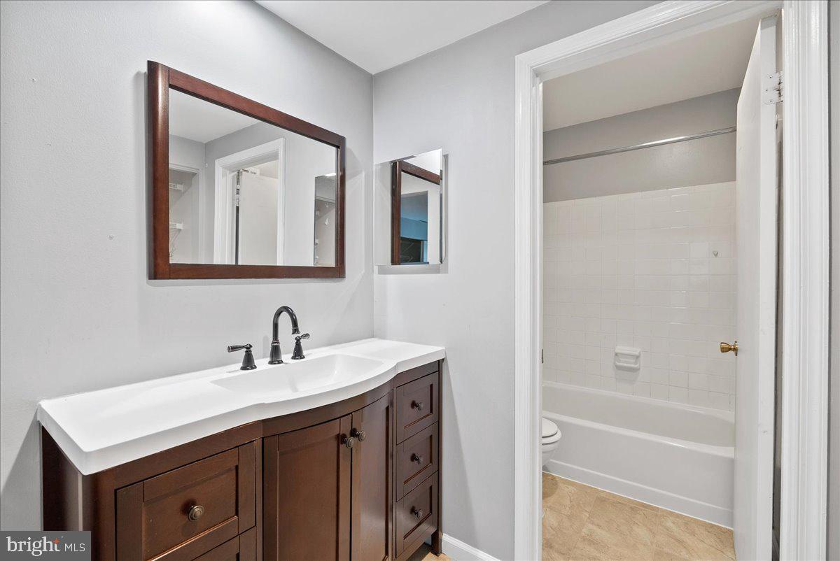 11146 Beaver Trail Court Reston, VA 20191 - Photo 15 of 17 a bathroom with a sink a vanity and a mirror