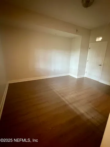 a white toilet sitting next to a bath tub and a shower